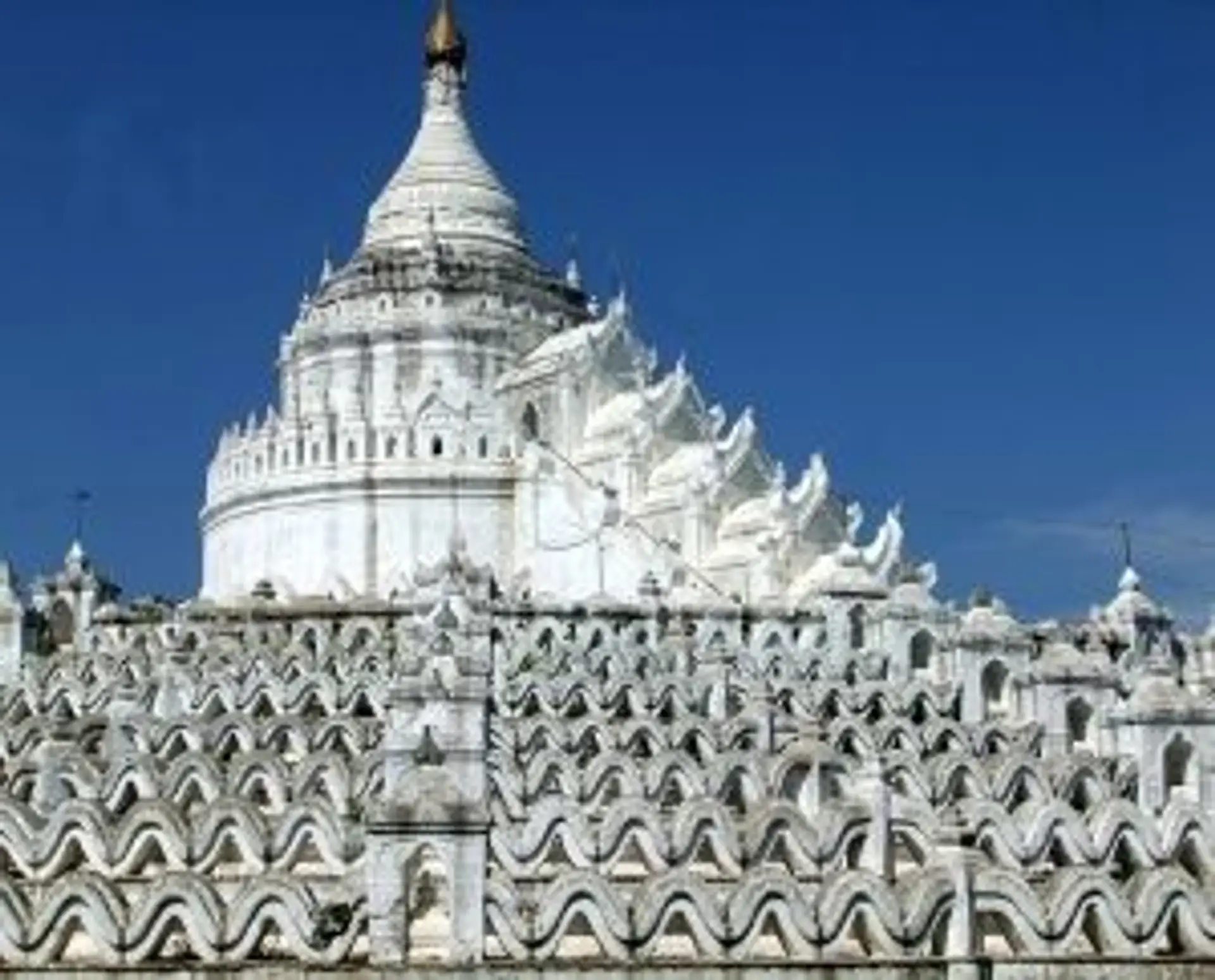 Travel in Asia - White stone temple structures of the Hsinbyume Pagoda in Myanmar