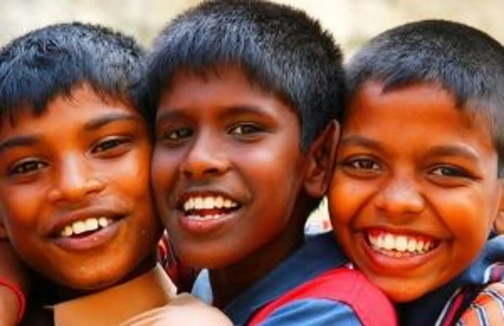Travel in Asia - Three boys from Sri Lanka smiling
