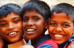 Travel in Asia - Three boys from Sri Lanka smiling