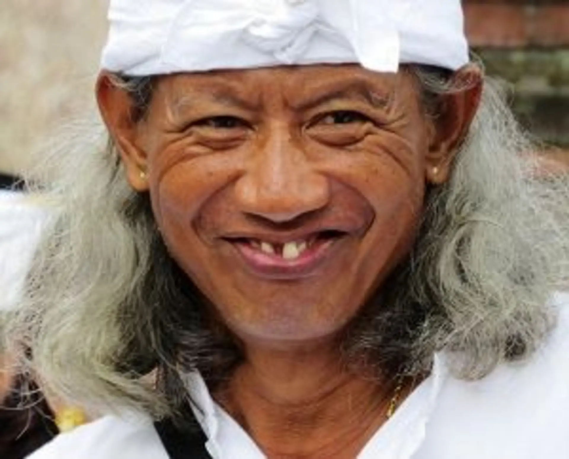 Travel in Asia - Older man with white hair smiling