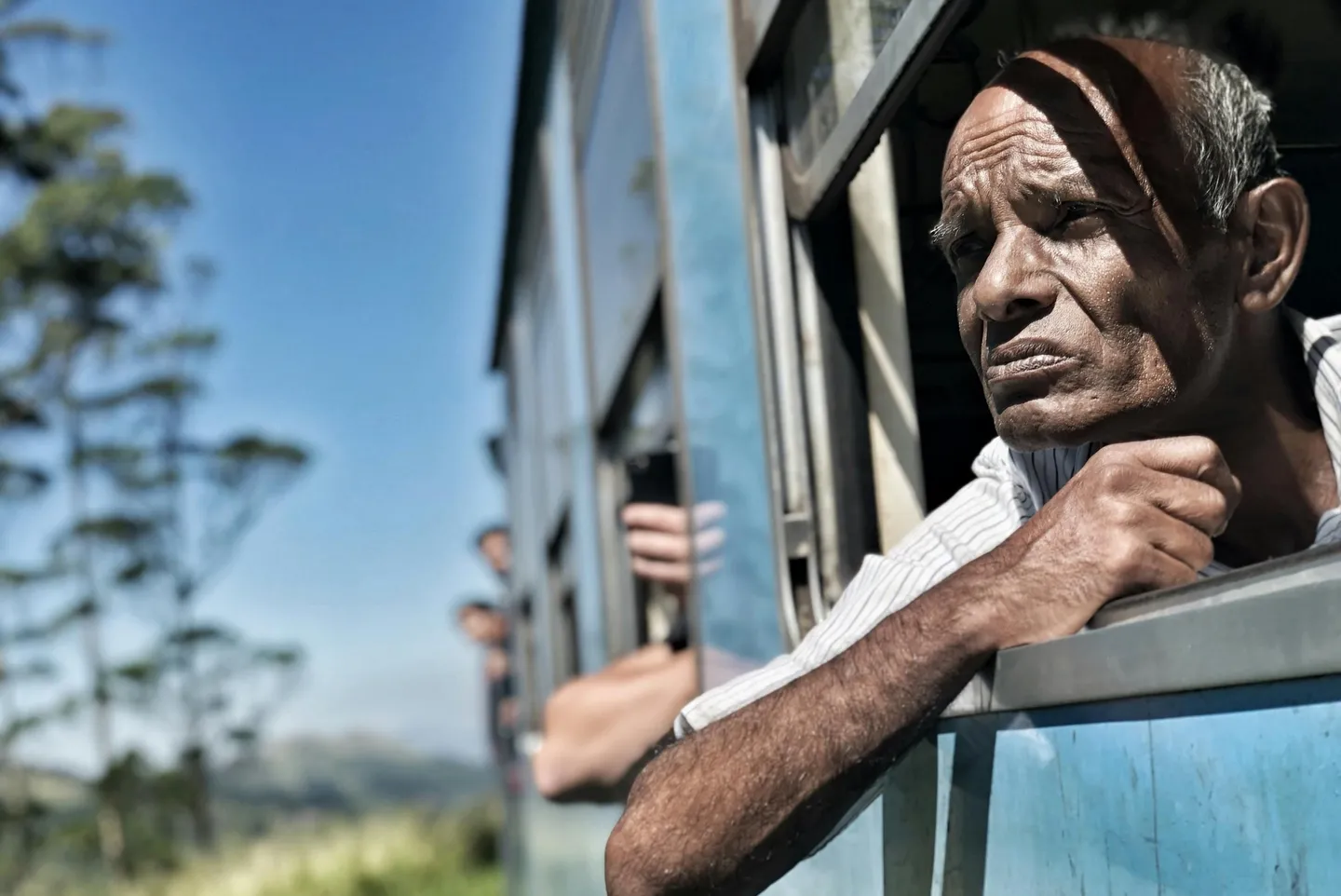 pexels- Sri Lanka man train window blue.jpg