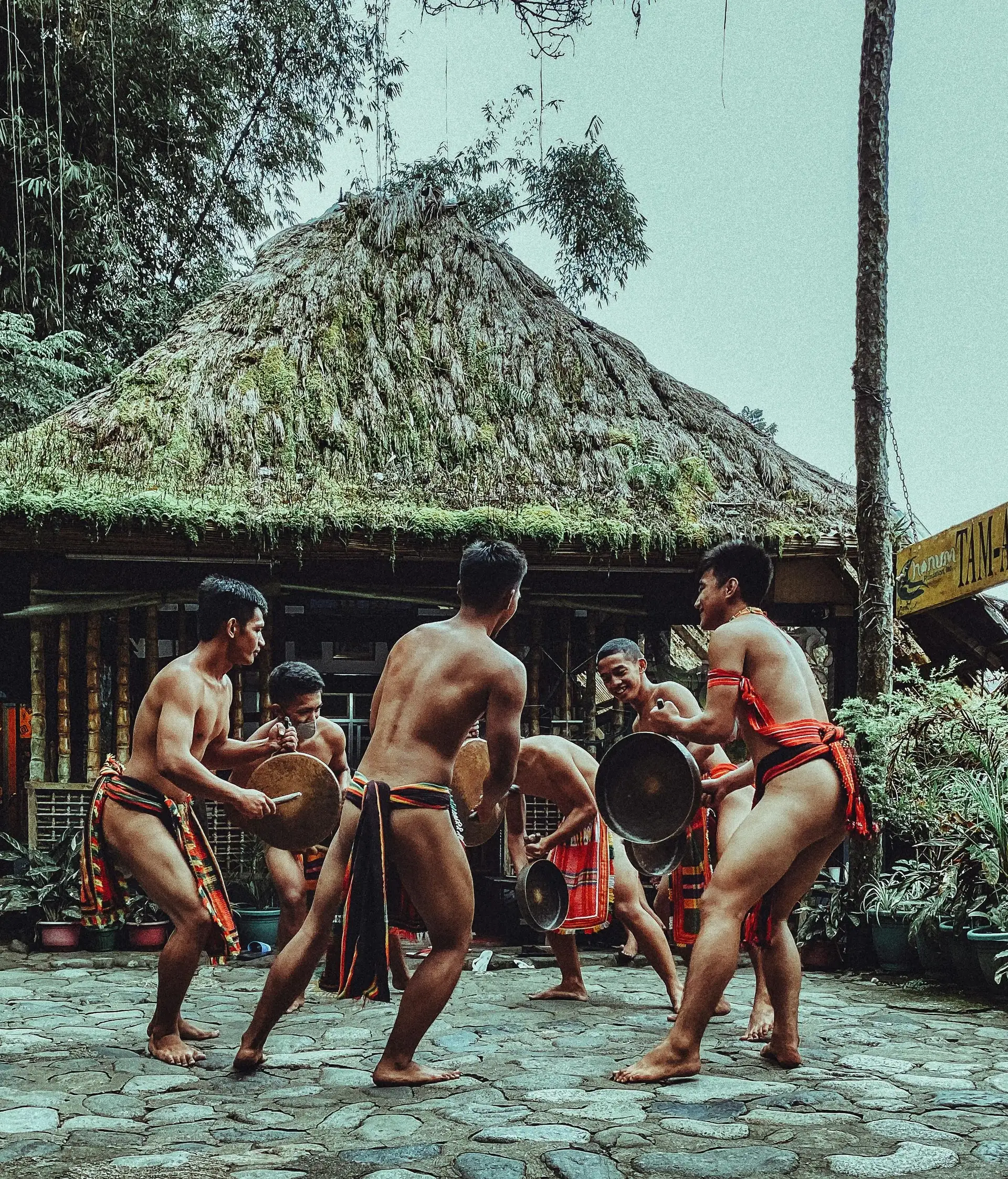 Travel in Asia - Shirtless men performing a traditional dance in the Philippines