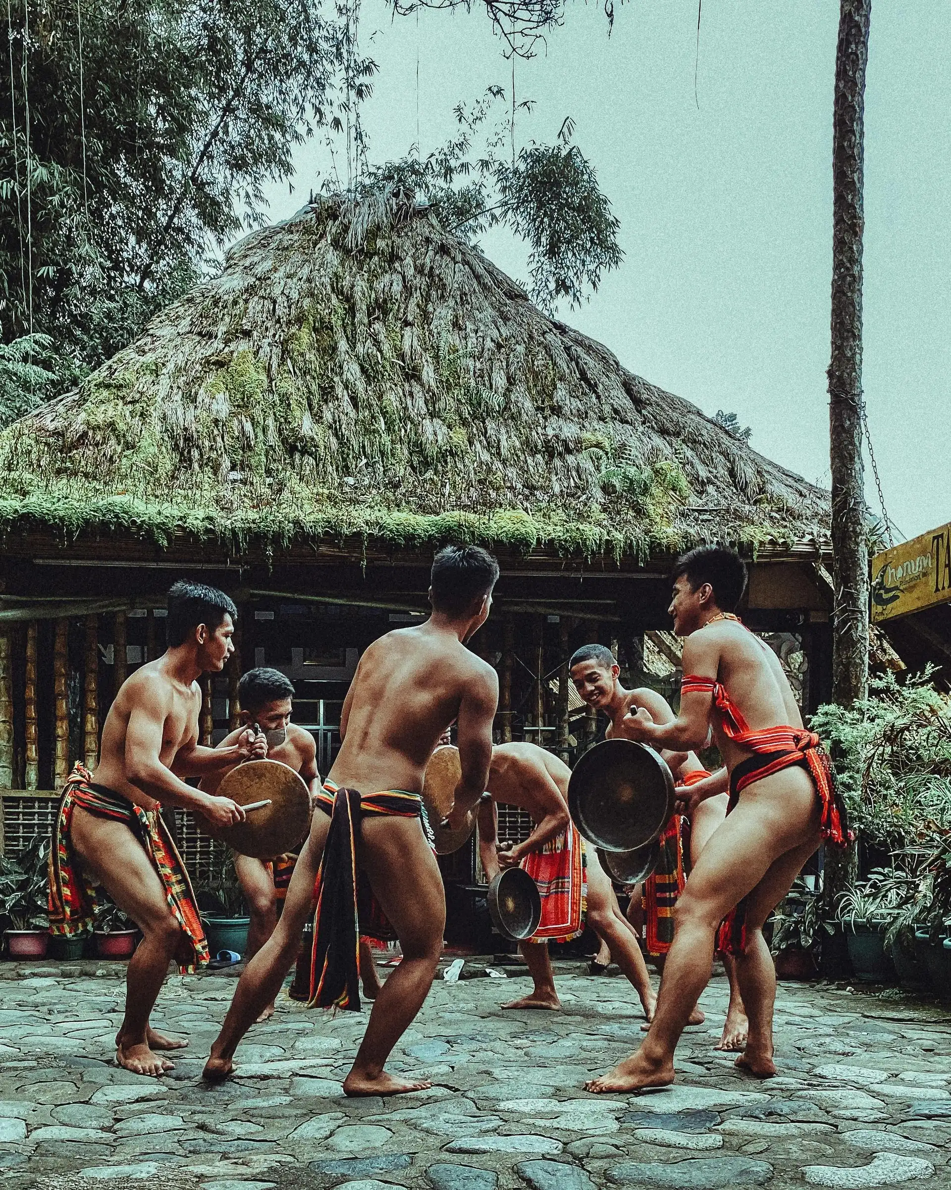 Travel in Asia - Shirtless men performing a traditional dance in the Philippines