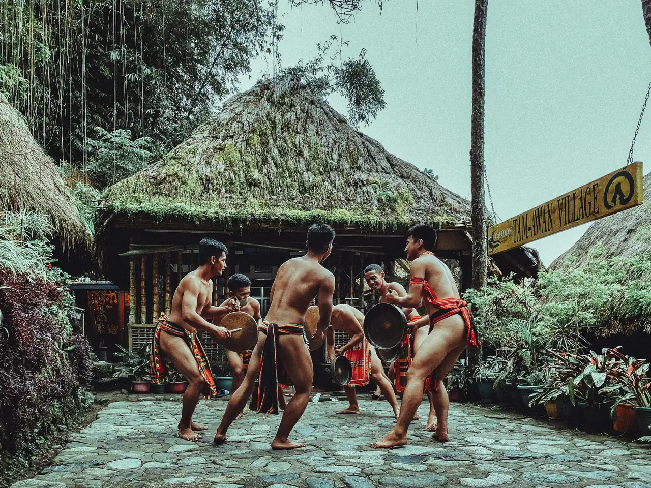 Travel in Asia - Shirtless men performing a traditional dance in the Philippines