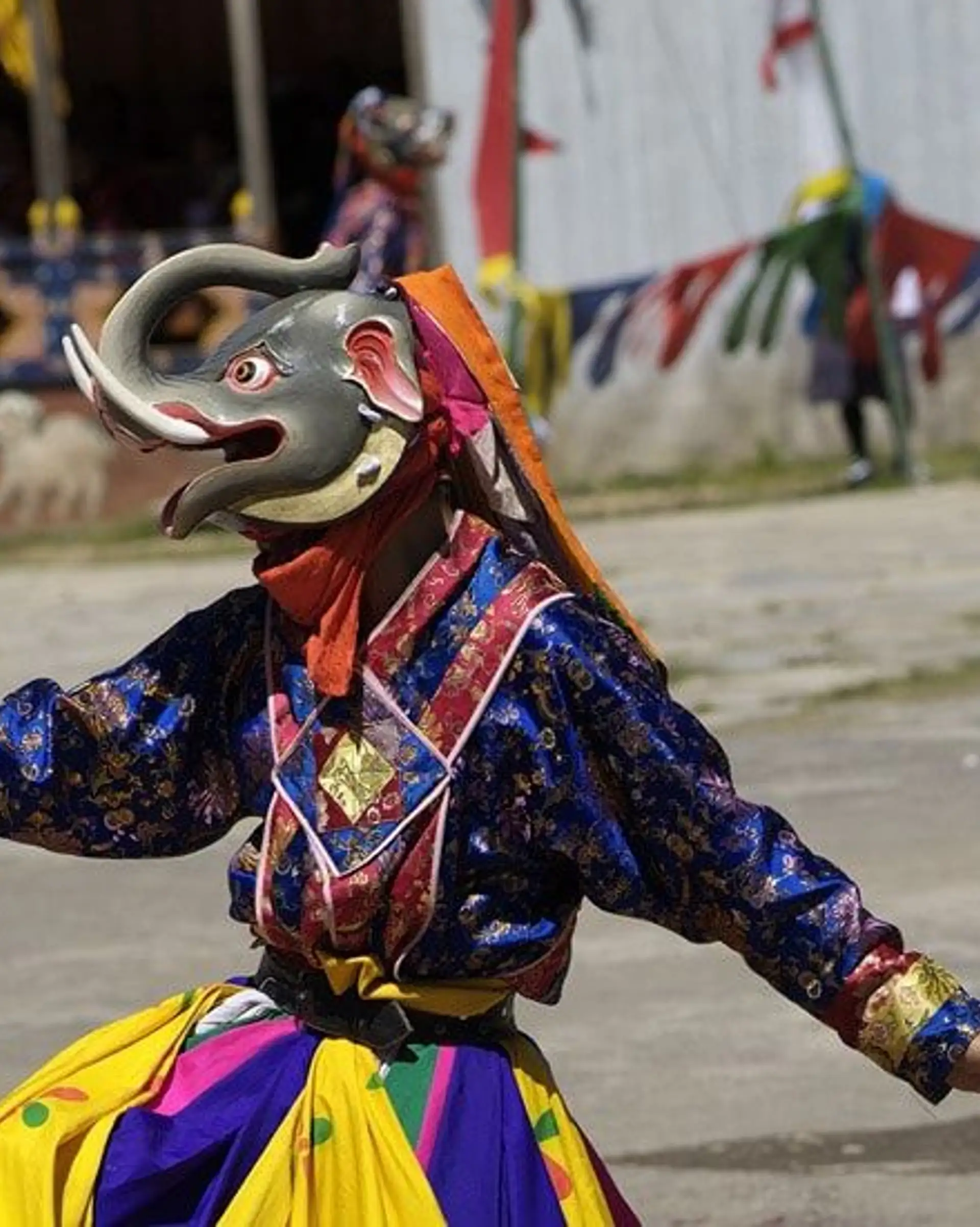 Travel in Asia - Masked monks dancing in a traditional Tshechu religious festival in Bhutan 
