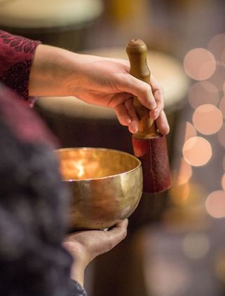 Travel in Asia - A monk playing a singing bowl in Ladakh, India