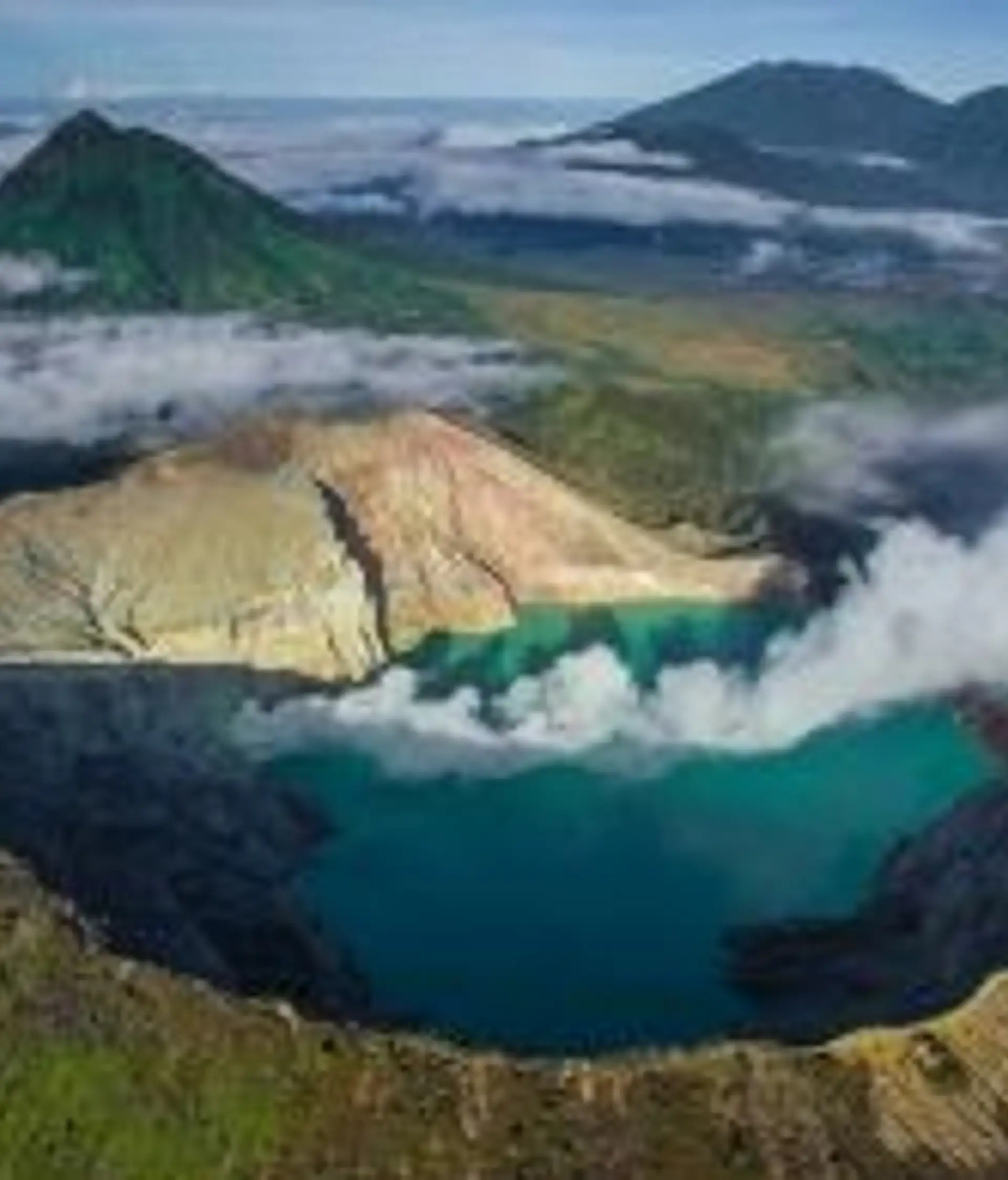 Travel in Asia - Aerial view of the smoking volcanic Ijen crater