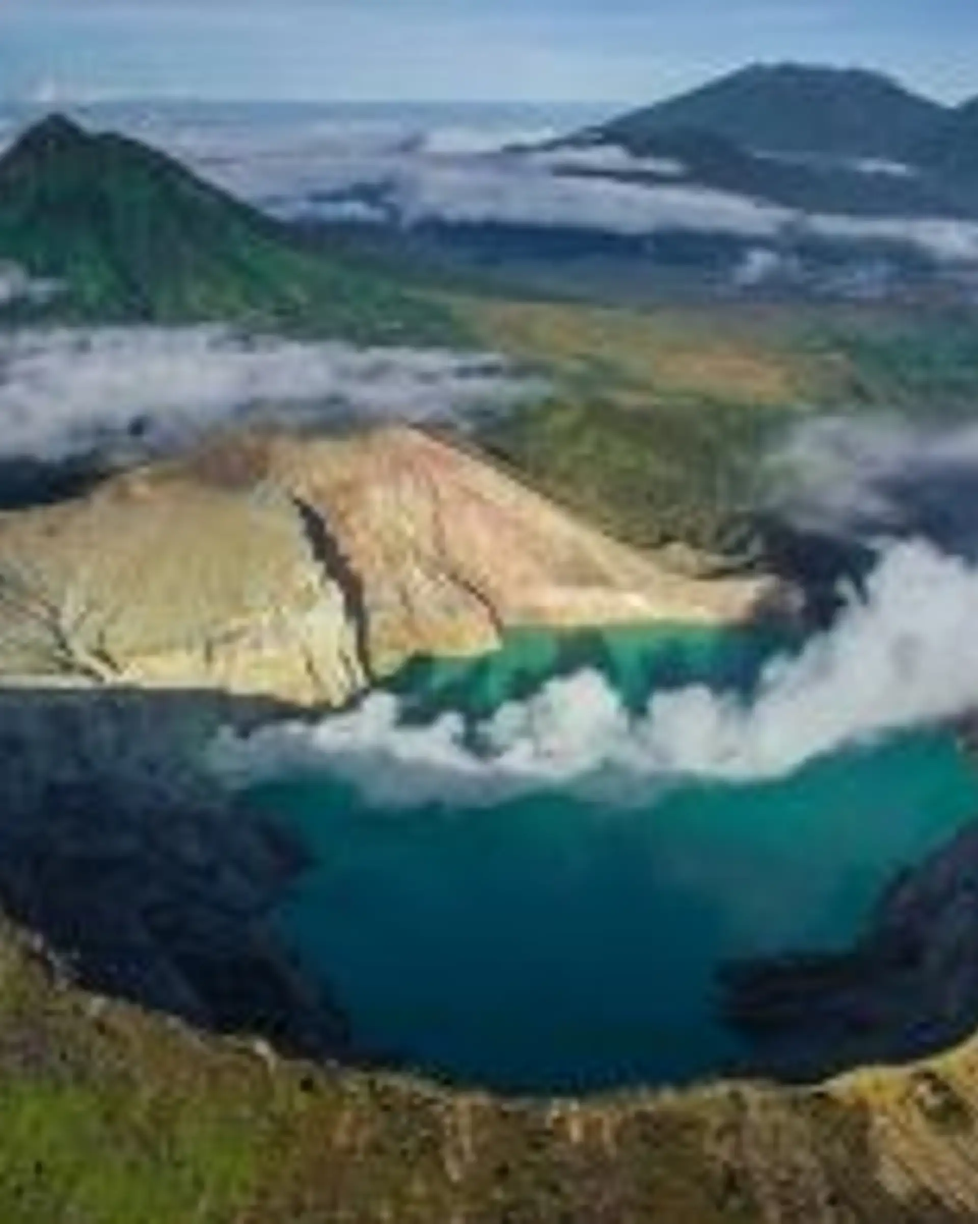 Travel in Asia - Aerial view of the smoking volcanic Ijen crater
