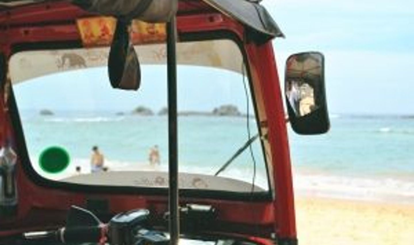 Travel in Asia - A tuk tuk waiting at a sunny golden sand beach in South Sri Lanka