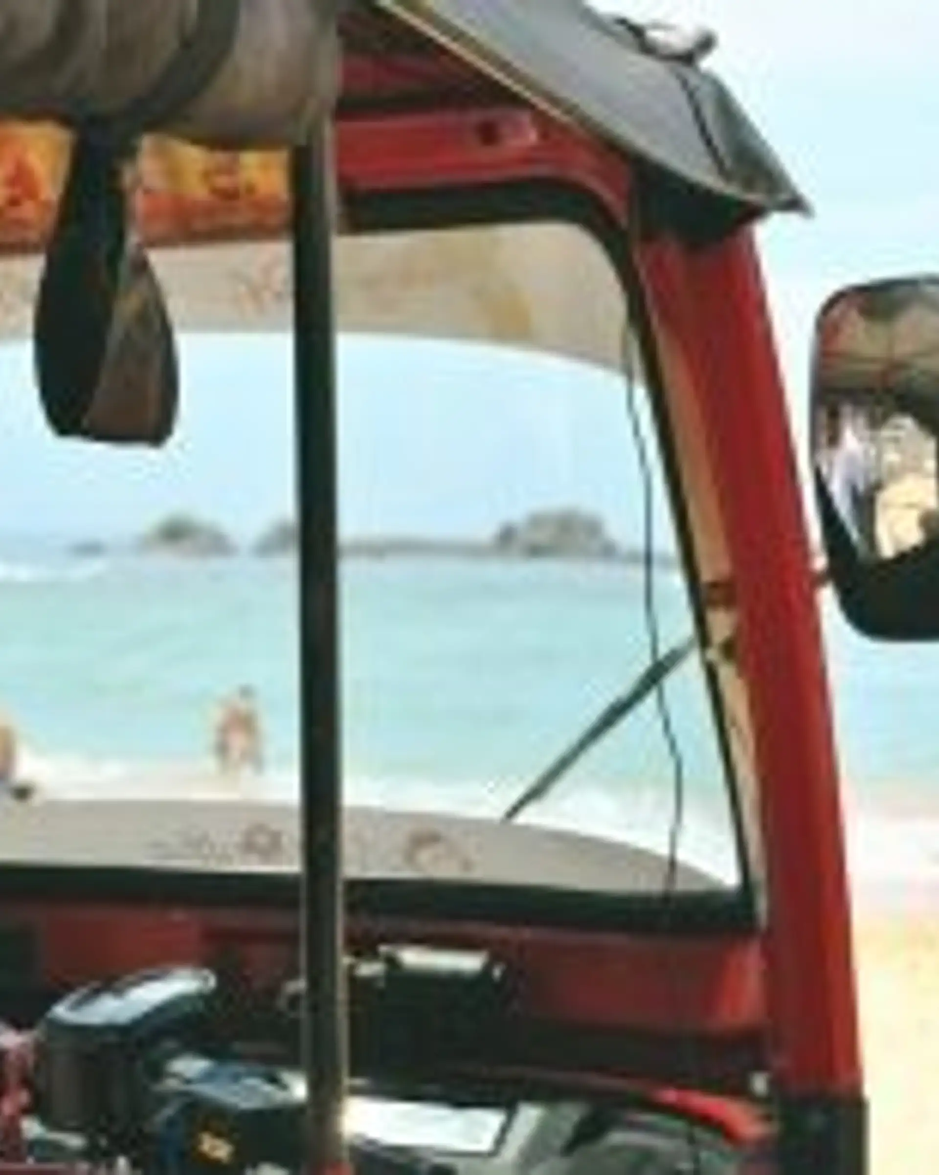Travel in Asia - A tuk tuk waiting at a sunny golden sand beach in South Sri Lanka