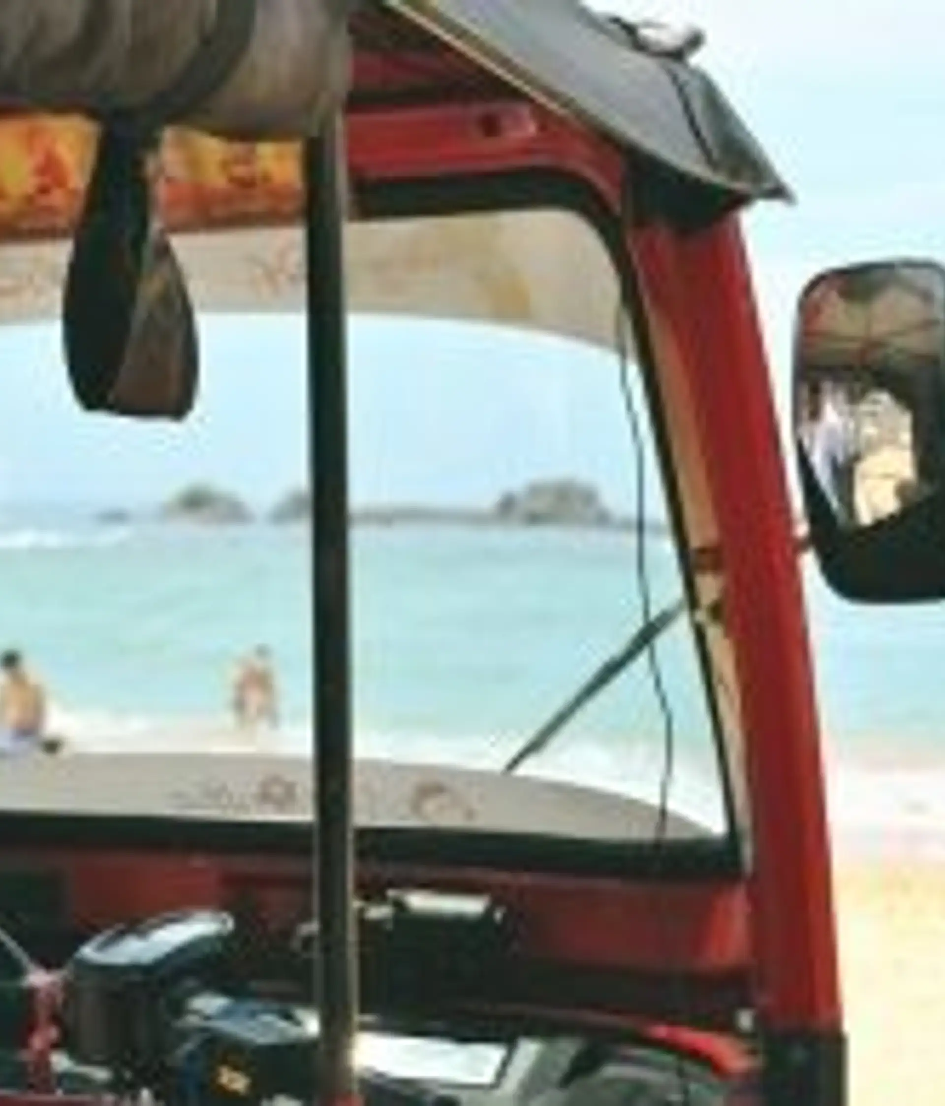 Travel in Asia - A tuk tuk waiting at a sunny golden sand beach in South Sri Lanka