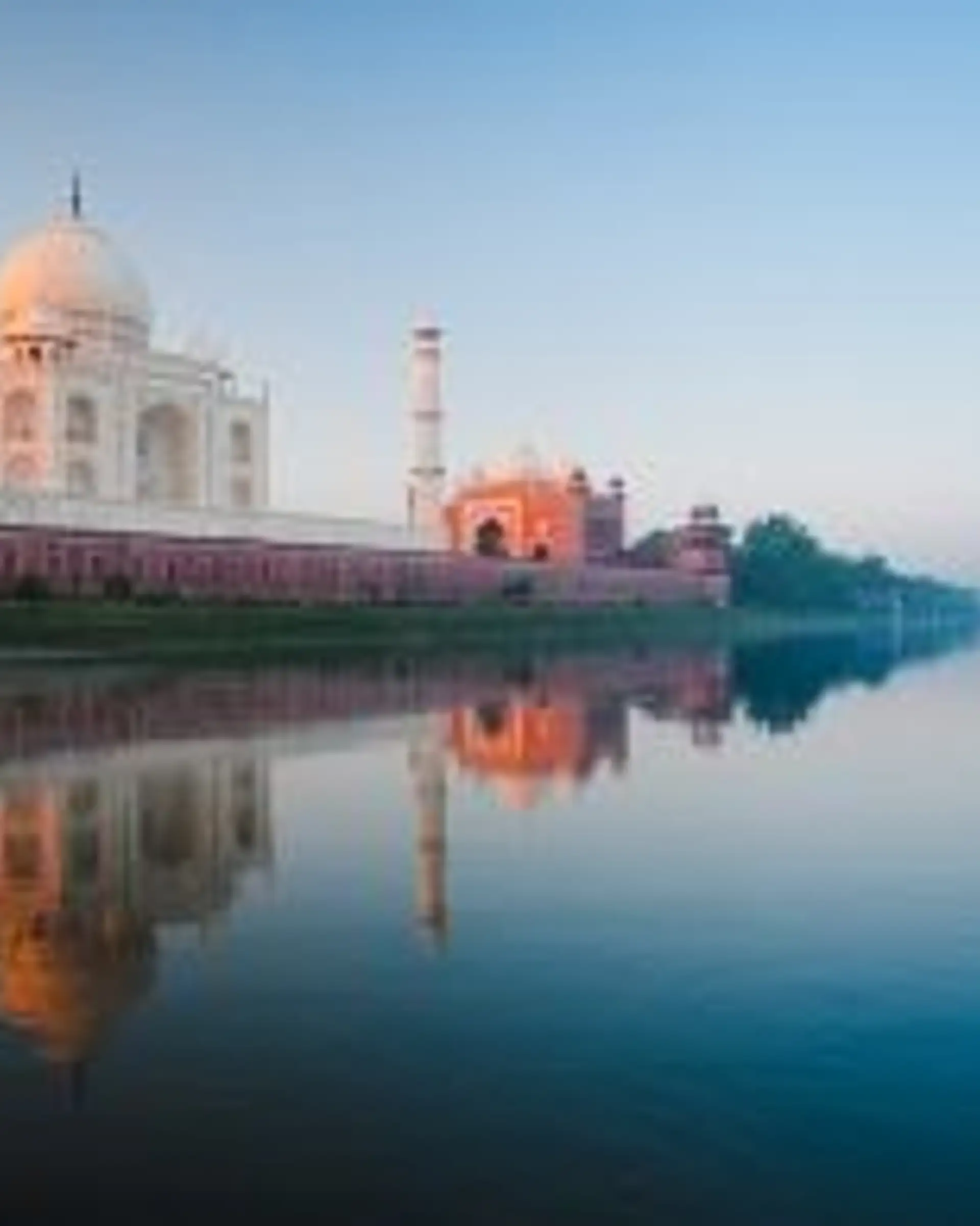 Travel in Asia - The Taj Majal seen from nearby river in morning light