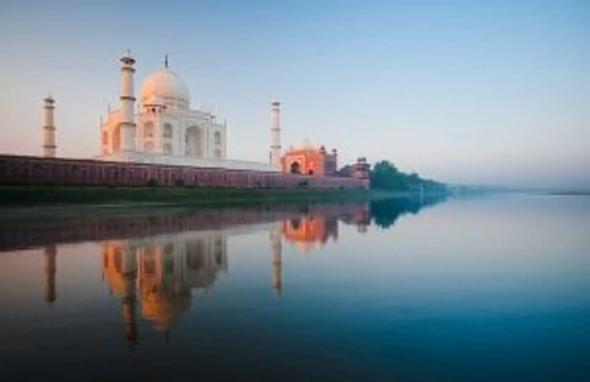 Travel in Asia - The Taj Majal seen from nearby river in morning light