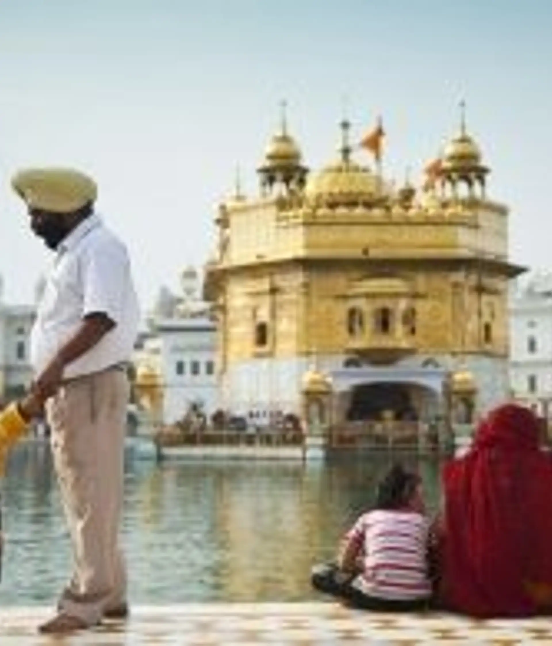 Travel in Asia - Visitors in front of the Sri Harmandir Sahib, or Golden Temple, in Amritsar, Punjab, India