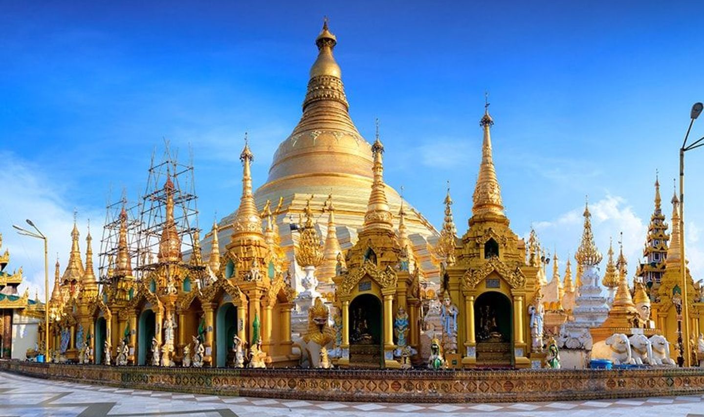 Travel in Asia - The golden-domed Shwedagon Pagoda on a sunny day in Yangon, Myanmar