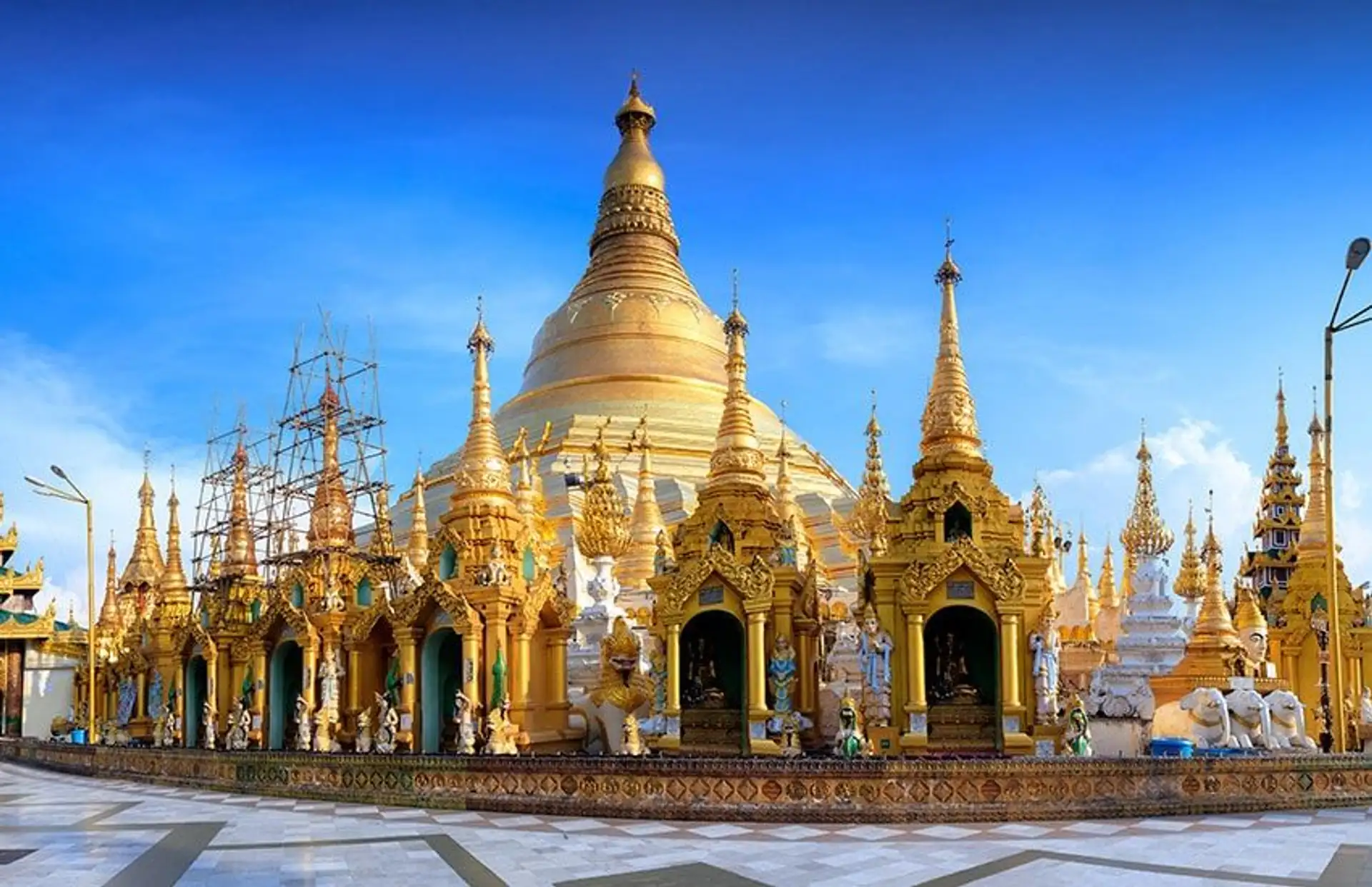 Travel in Asia - The golden-domed Shwedagon Pagoda on a sunny day in Yangon, Myanmar