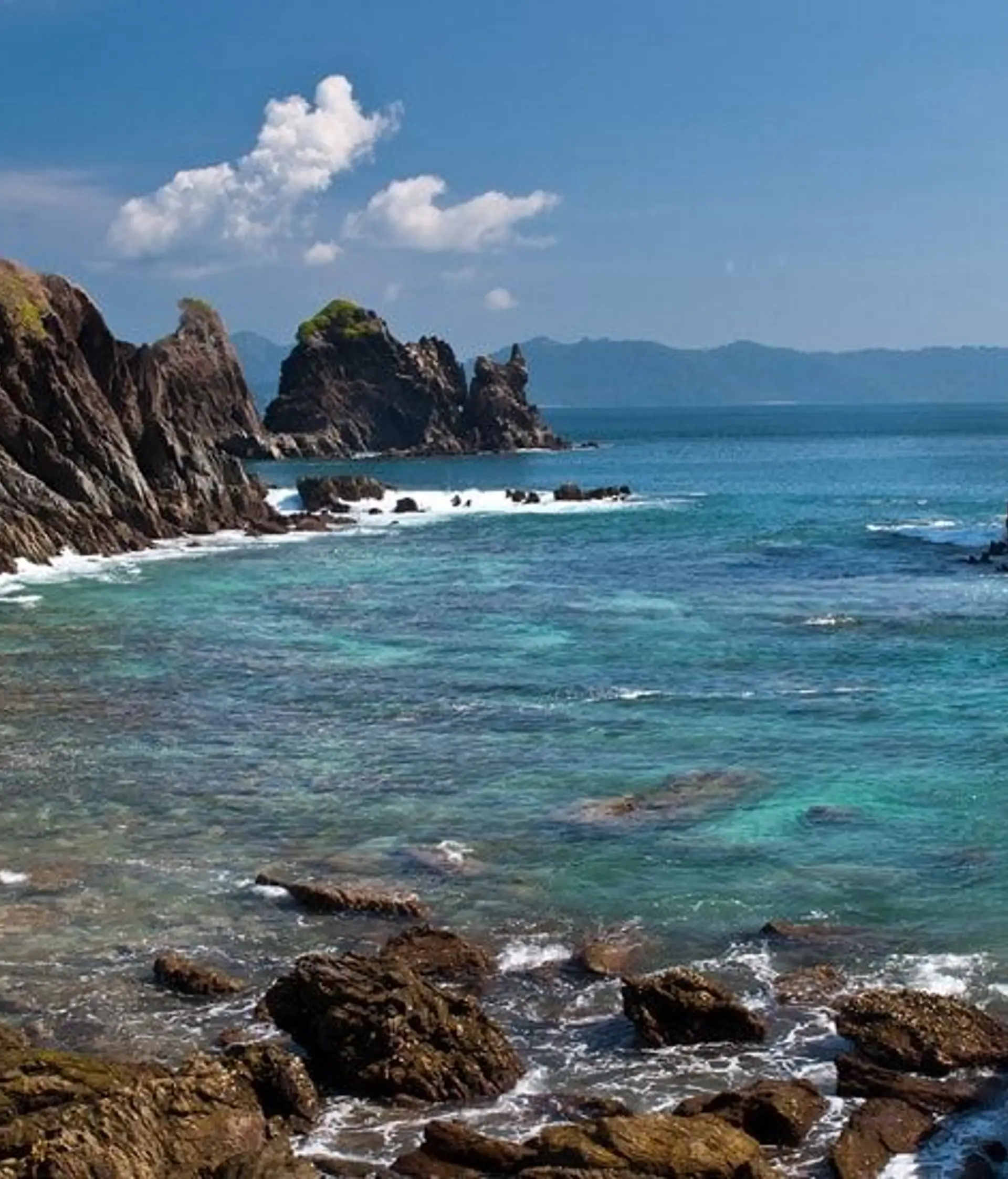 Travel in Asia - A rocky beach on a sunny day on an island in the Mergui Archipelago in Myanmar (Burma)