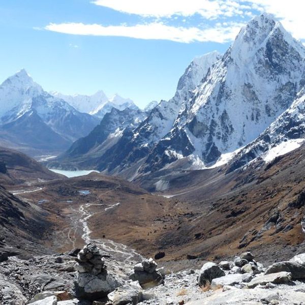 Travel in Asia - Majestic view over the Chola Valley in Nepal featuring featuring the snow-capped peaks of Cholatse and Ama Dablam