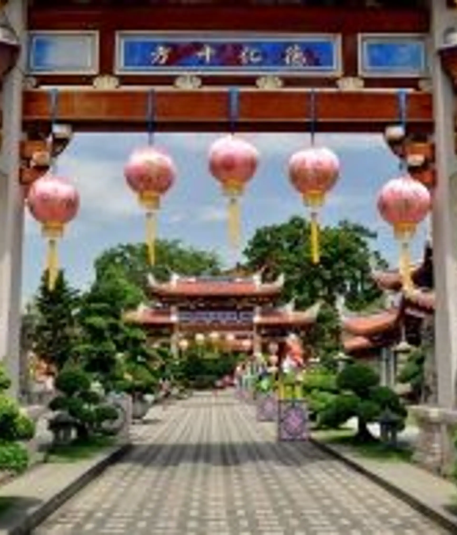 Travel in Asia - Singapore's Lian Shan Shuang Lin Monastery with lanterns hanging from its gate
