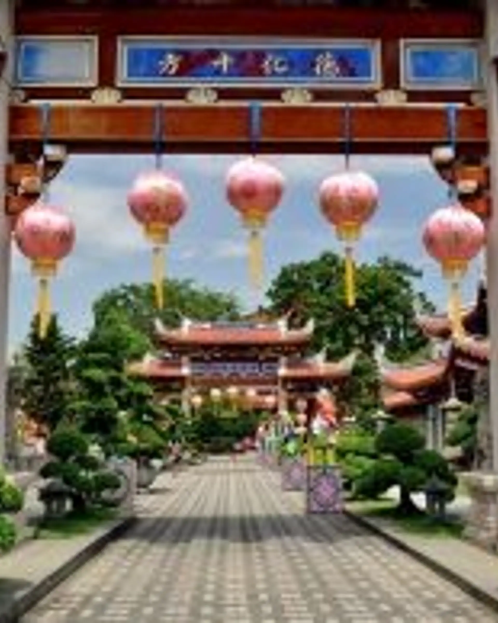 Travel in Asia - Singapore's Lian Shan Shuang Lin Monastery with lanterns hanging from its gate