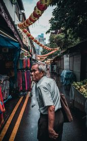 Travel in Asia - Man walking through alleys of Singapore's Chinatown