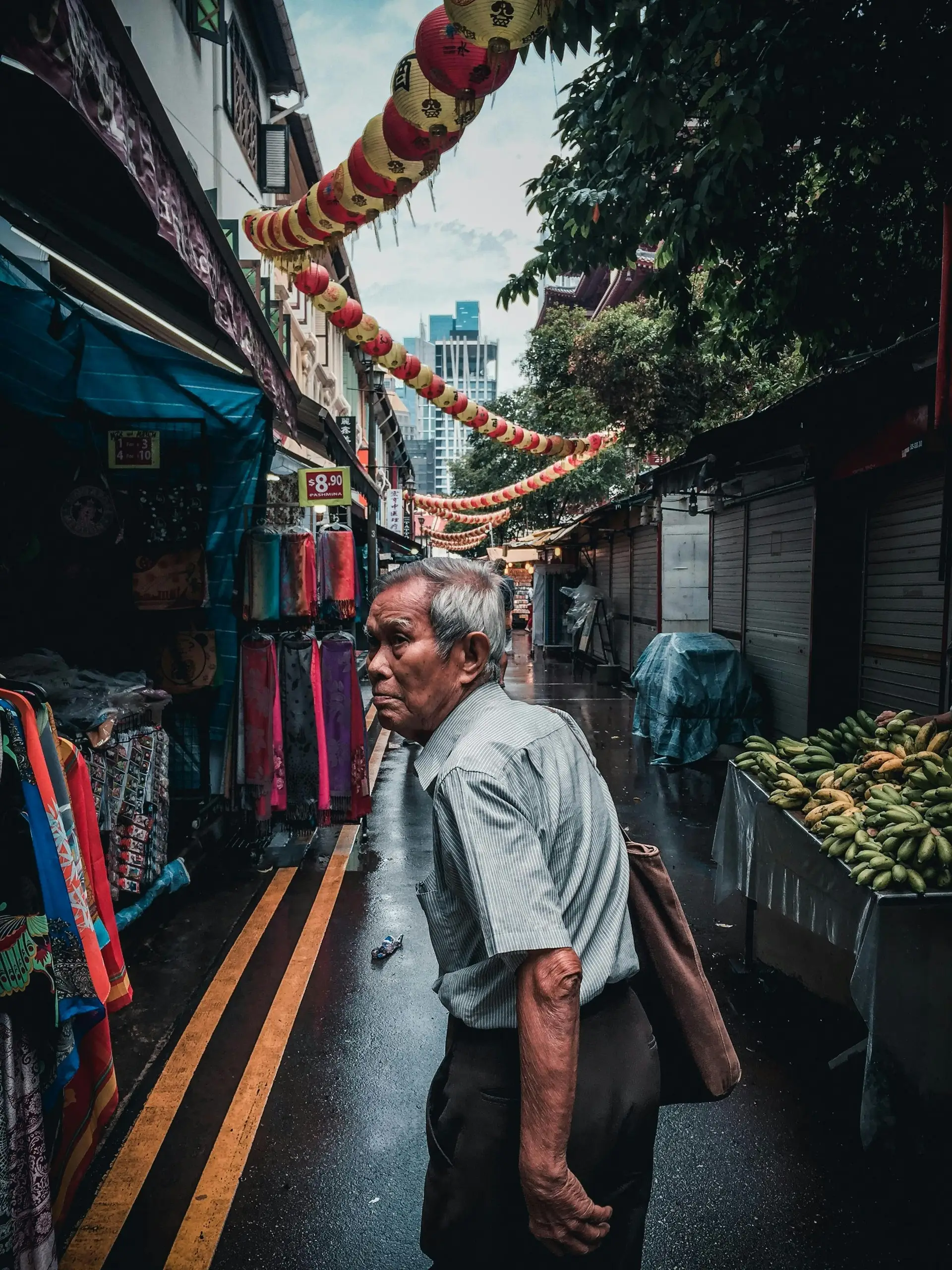 Travel in Asia - Man walking through alleys of Singapore's Chinatown