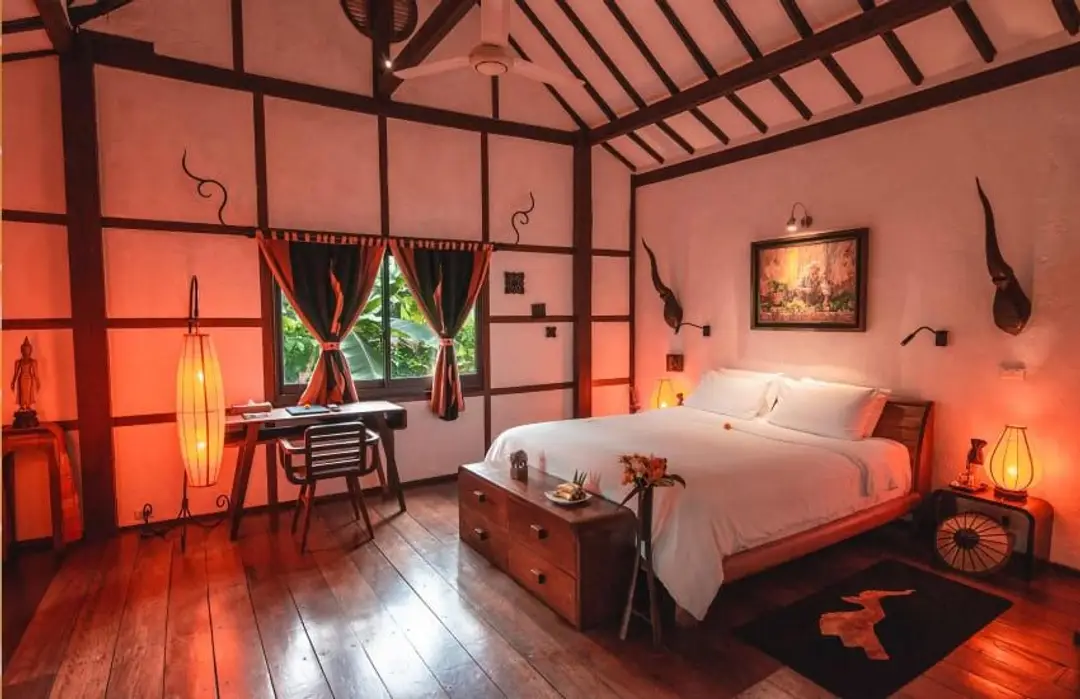 Voyage au Laos - chambre d’hôtel traditionnelle